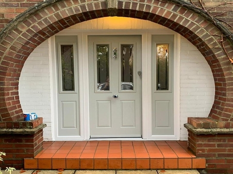An Olive Grey front door with side panels